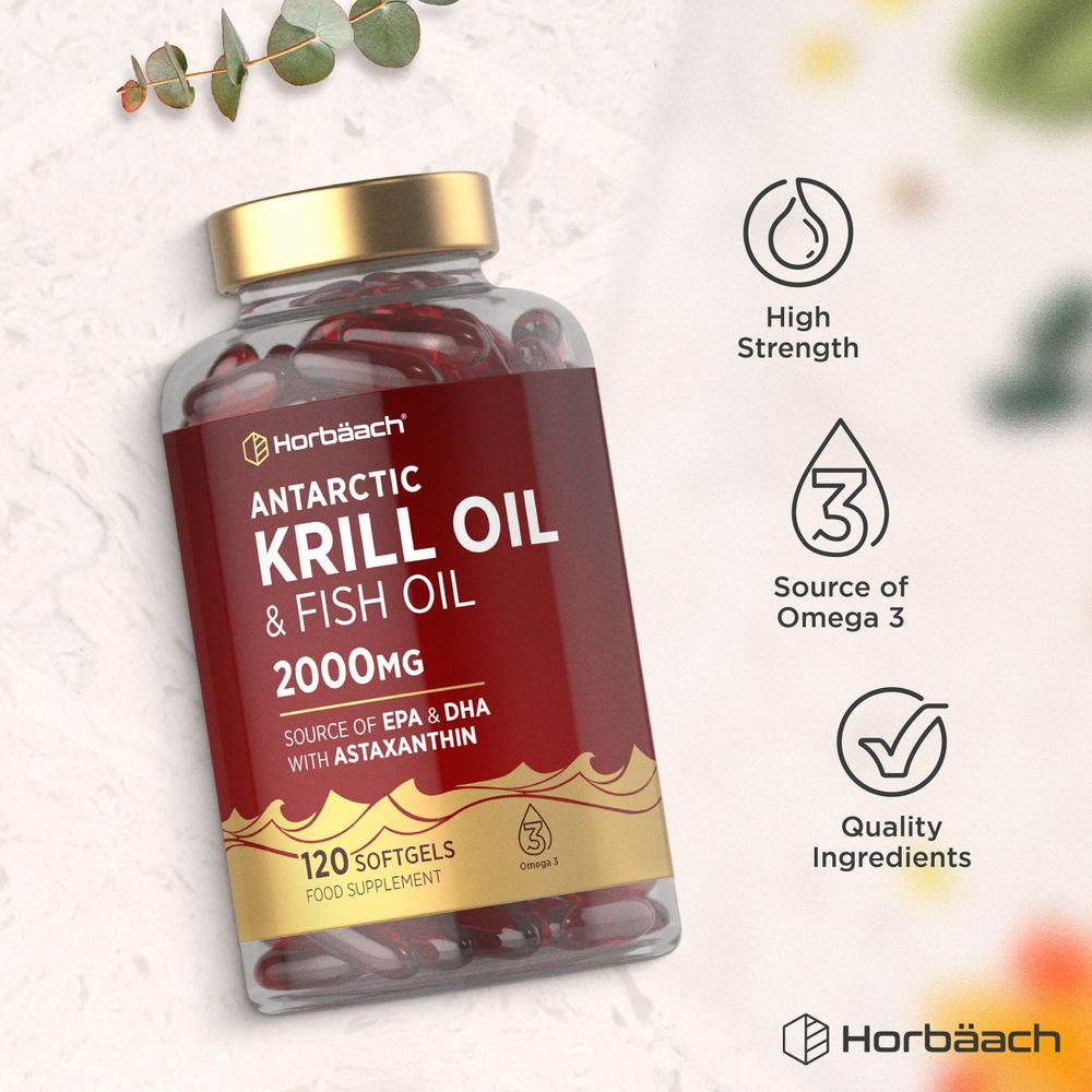 A hand holds a clear bottle of Red Antarctic Krill Oil & Fish Oil 2000mg softgels, 120 count.