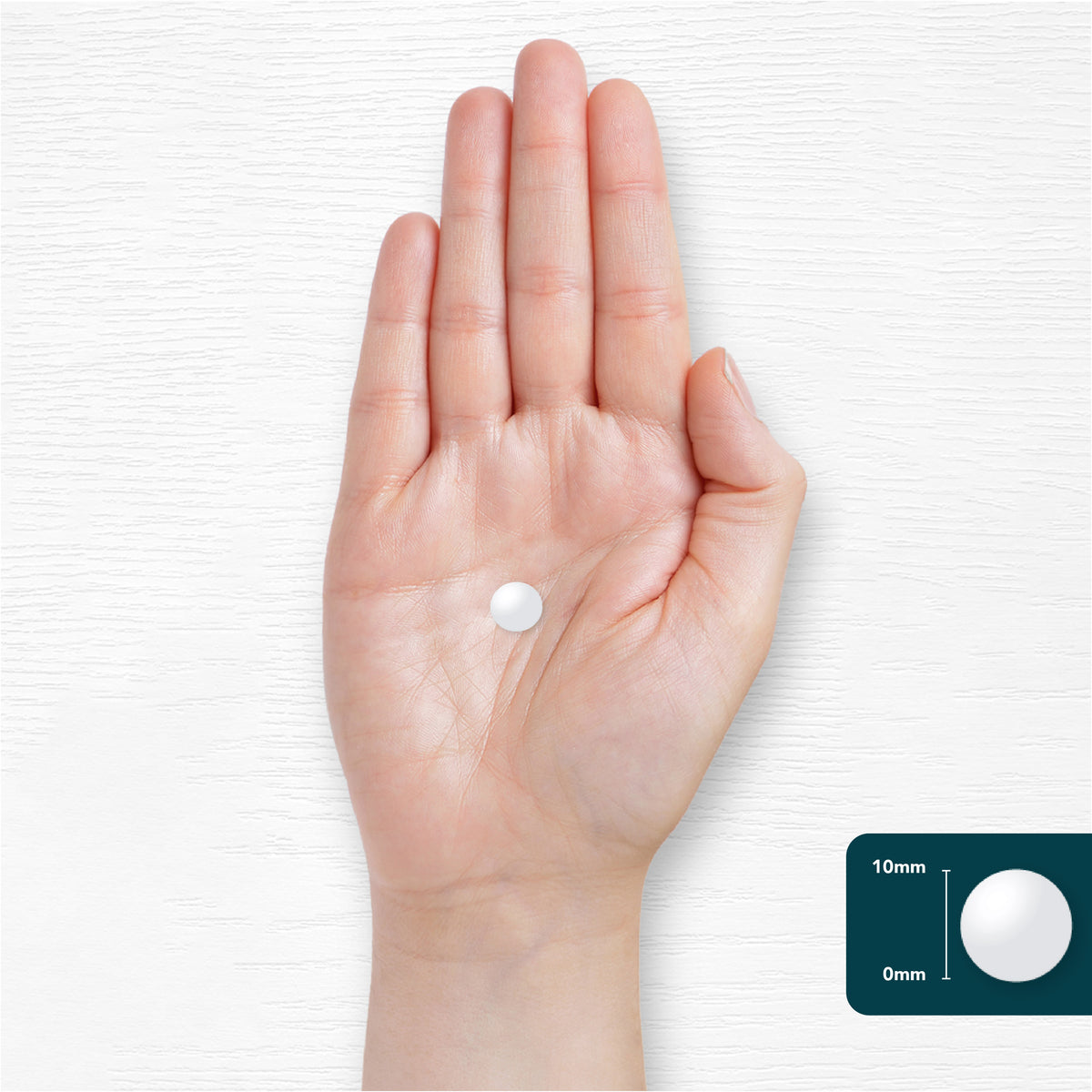 White 10mm L-Methylfolate vegan tablet on a hand.