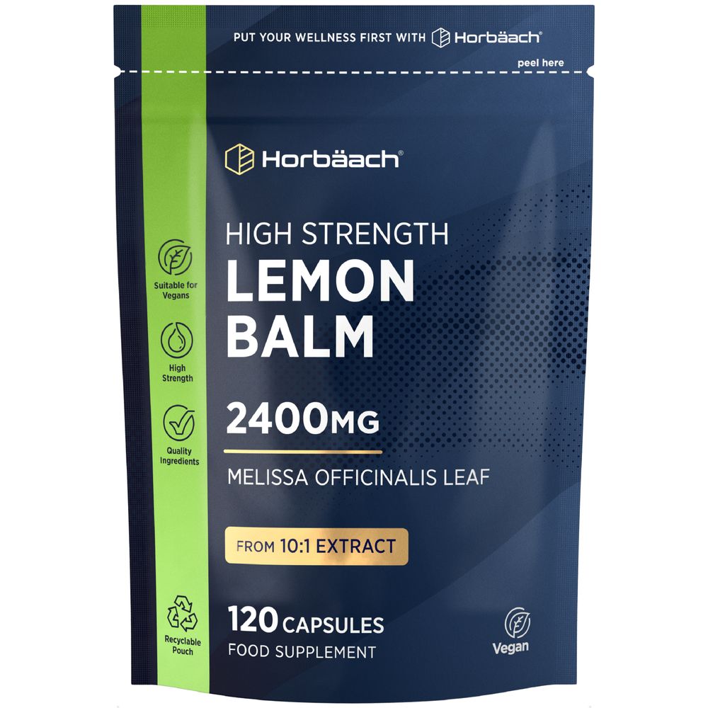 Image of a hand holding a bottle of Lemon Balm 2400mg, containing 120 capsules, on a bulk scale.