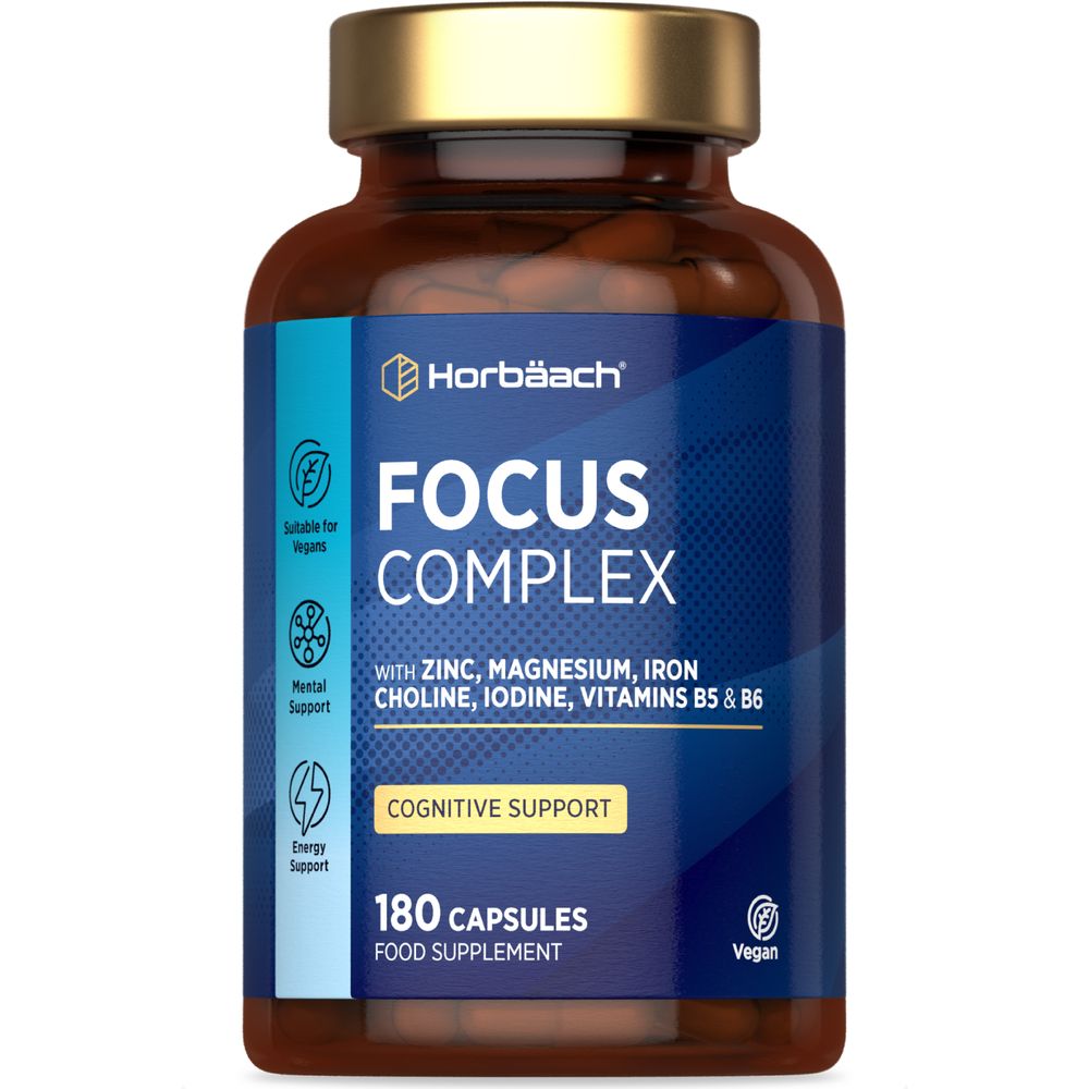 A bottle of Horbäach Focus Complex containing 180 capsules shown on a hand for scale.