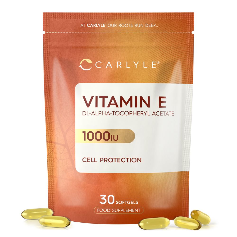 Hand holding softgels of Vitamin E DL-Alpha-Tocopheryl Acetate, 1000IU strength.