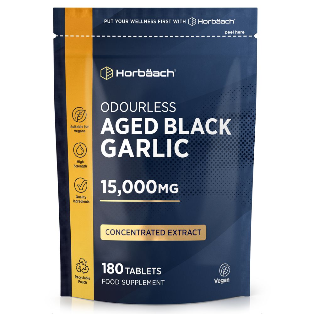 Hand holding a bottle of Odourless Aged Black Garlic 15,000MG Concentrated Extract, containing 180 tablets.