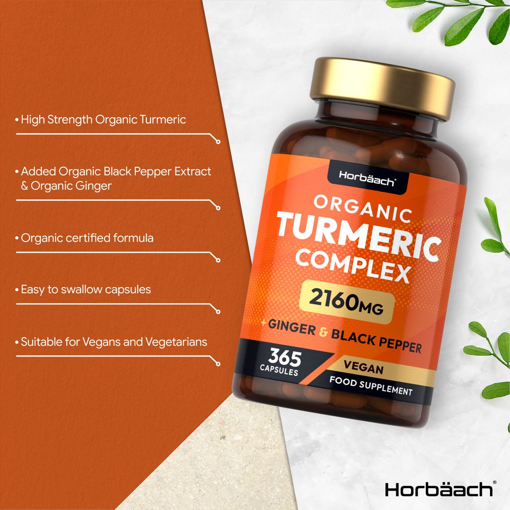 A hand holding a bottle of Organic Turmeric Complex, 2160mg, containing 365 vegan capsules.