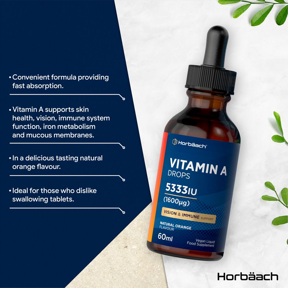 Hand holding Vitamin A Drops 5333IU (1600µg) 60ml liquid in a brown dropper bottle.