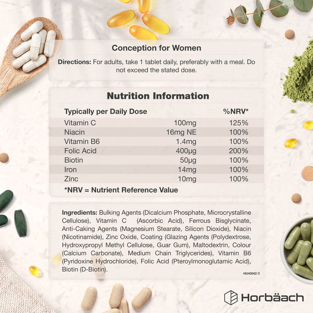 White Conception for Women Vegan Tablets displayed in a wooden spoon and scattered on a flat surface.