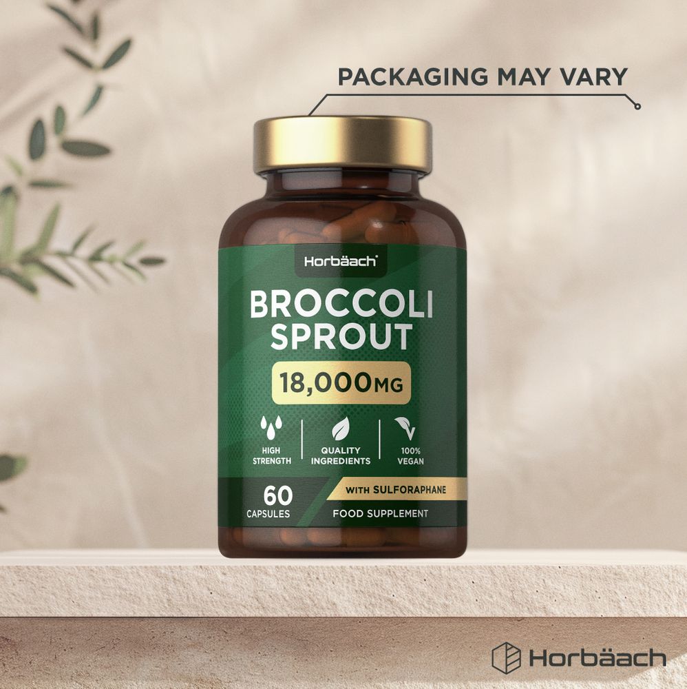 A hand holds a bottle labeled Broccoli Sprout 18,000MG with 60 vegan capsules inside.