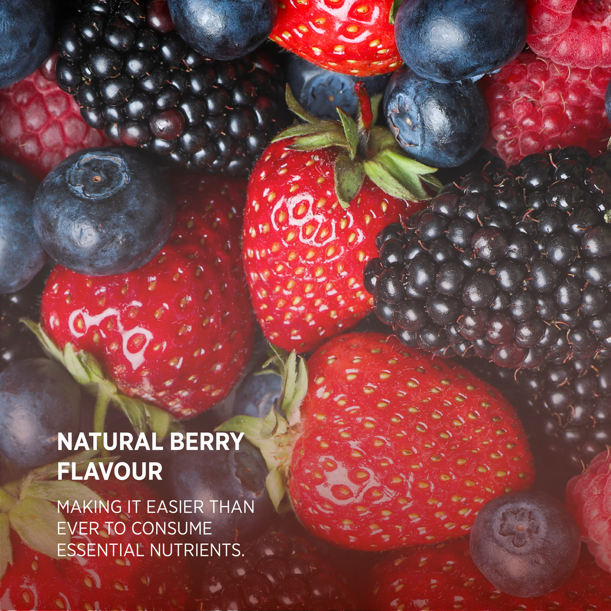 Close-up of mixed berries with text stating natural berry flavor makes it easier to consume essential nutrients.