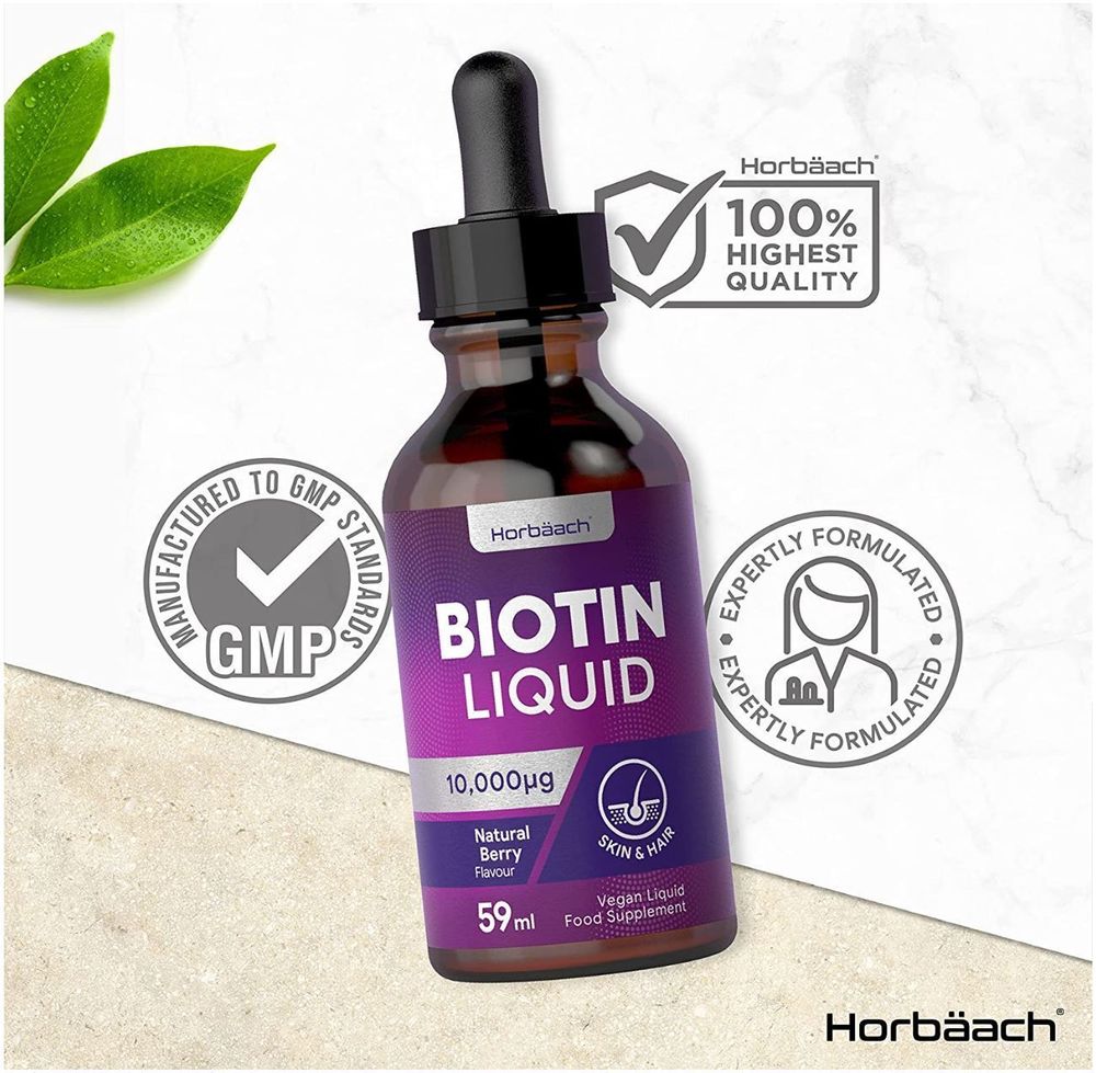 Horbäach Biotin 10,000µg Liquid, 59ml bottle shown next to a hand for size comparison.