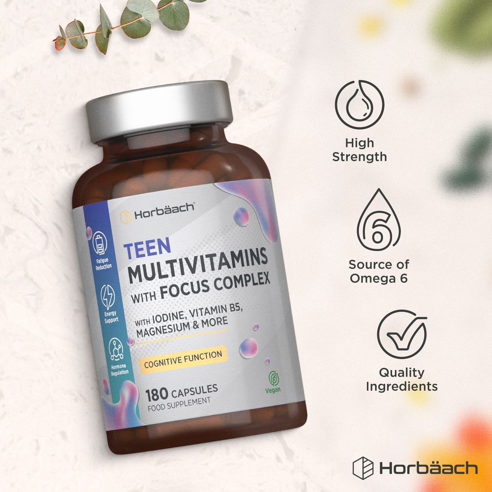 A bottle of Teen Multivitamins with Focus Complex containing 180 capsules, shown on a hand scale for size reference.