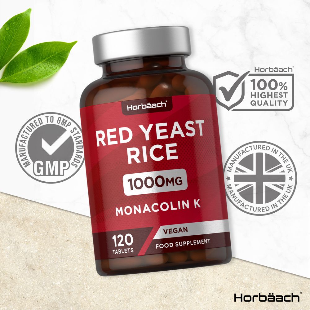 Hand holding Red Yeast Rice 1000mg bottle containing 120 tablets, shown on a scale to represent bulk quantity measurement.