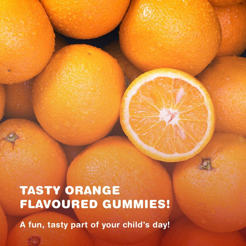 Pile of fresh oranges, one cut in half, with text: 'TASTY ORANGE FLAVOURED GUMMIES! A fun, tasty part of your child's day!'