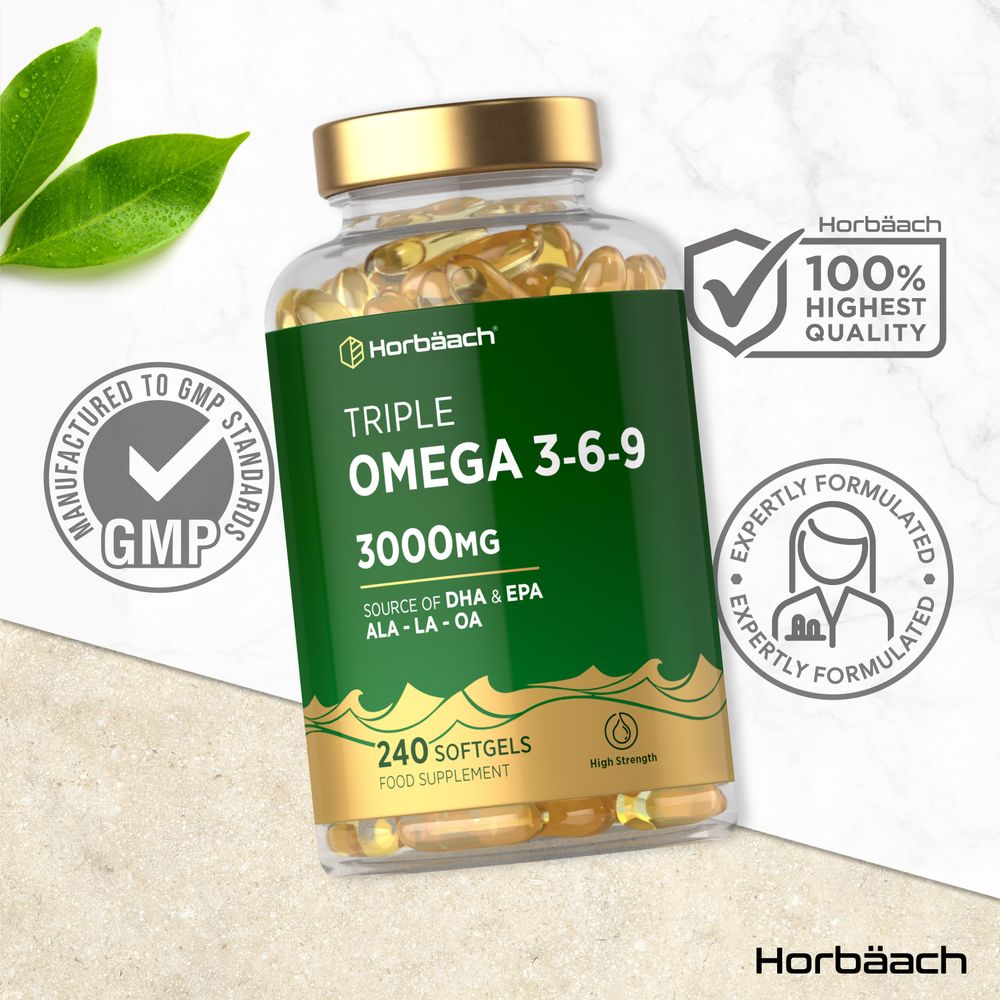 Horbäach Triple Omega 3-6-9 3000mg clear bottle with 240 yellow oval softgels, shown on hand scale.