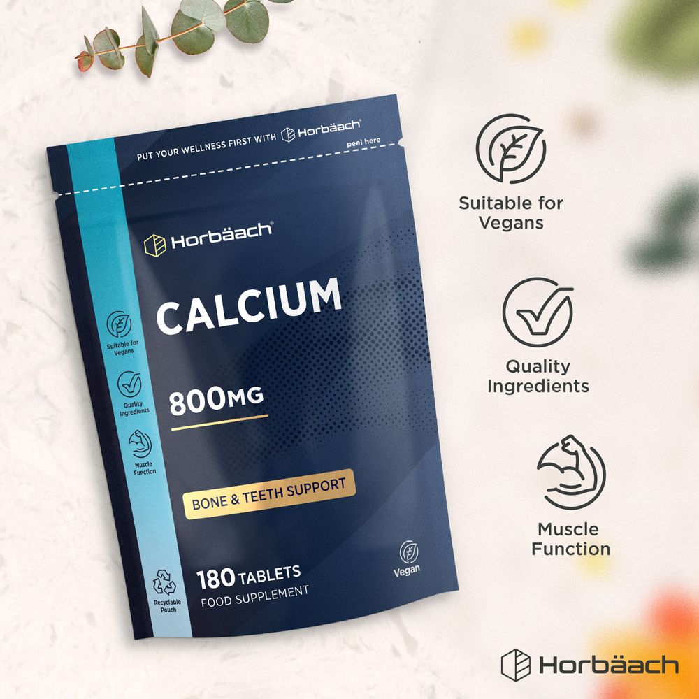 Horbäach Calcium Carbonate 800mg, 180 Vegan Tablets in a pouch shown on a hand scale.