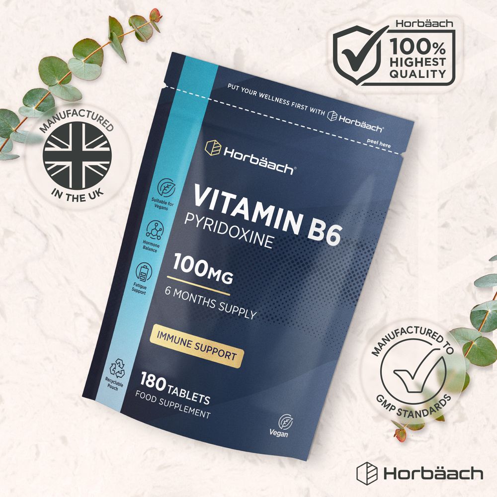 A container with 180 tablets of Vitamin B6 Pyridoxine 100mg shown on a bulk scale.