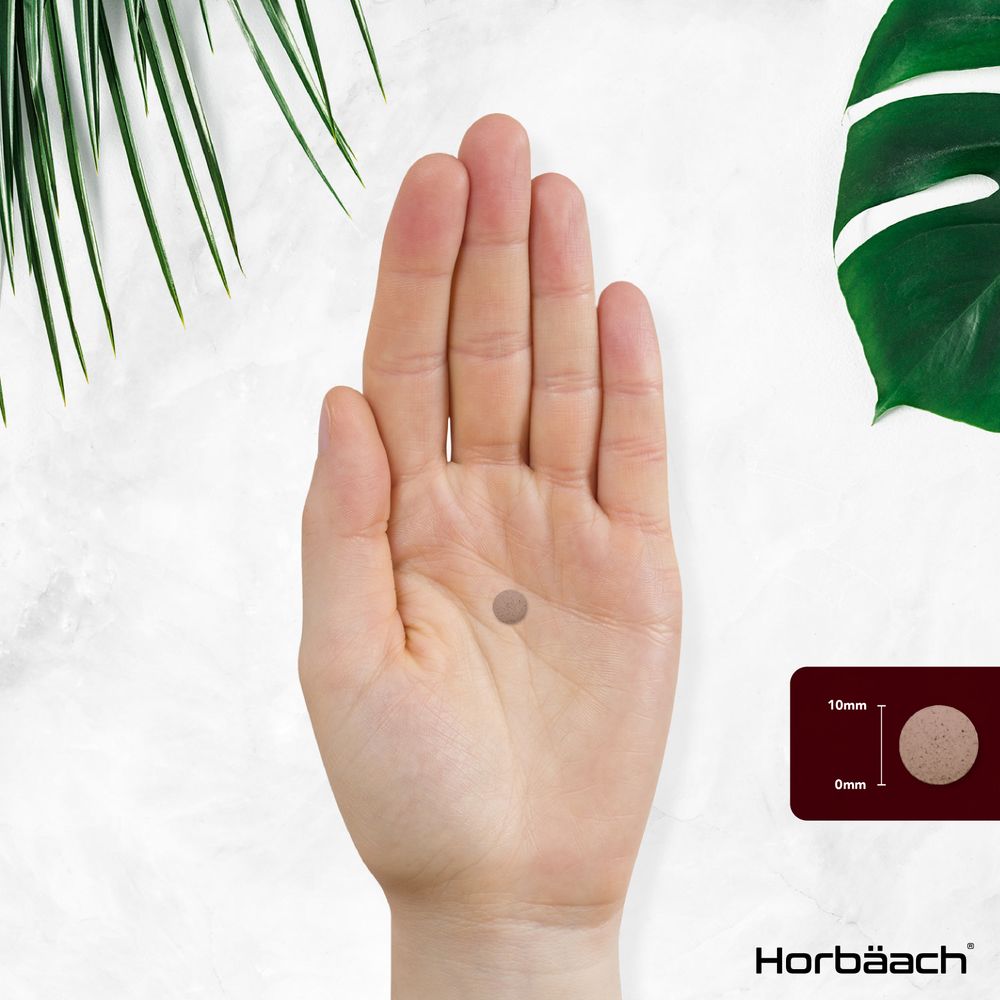 A 10mm round tablet held in a hand. A graphic shows the '10mm' measurement for the tablet.