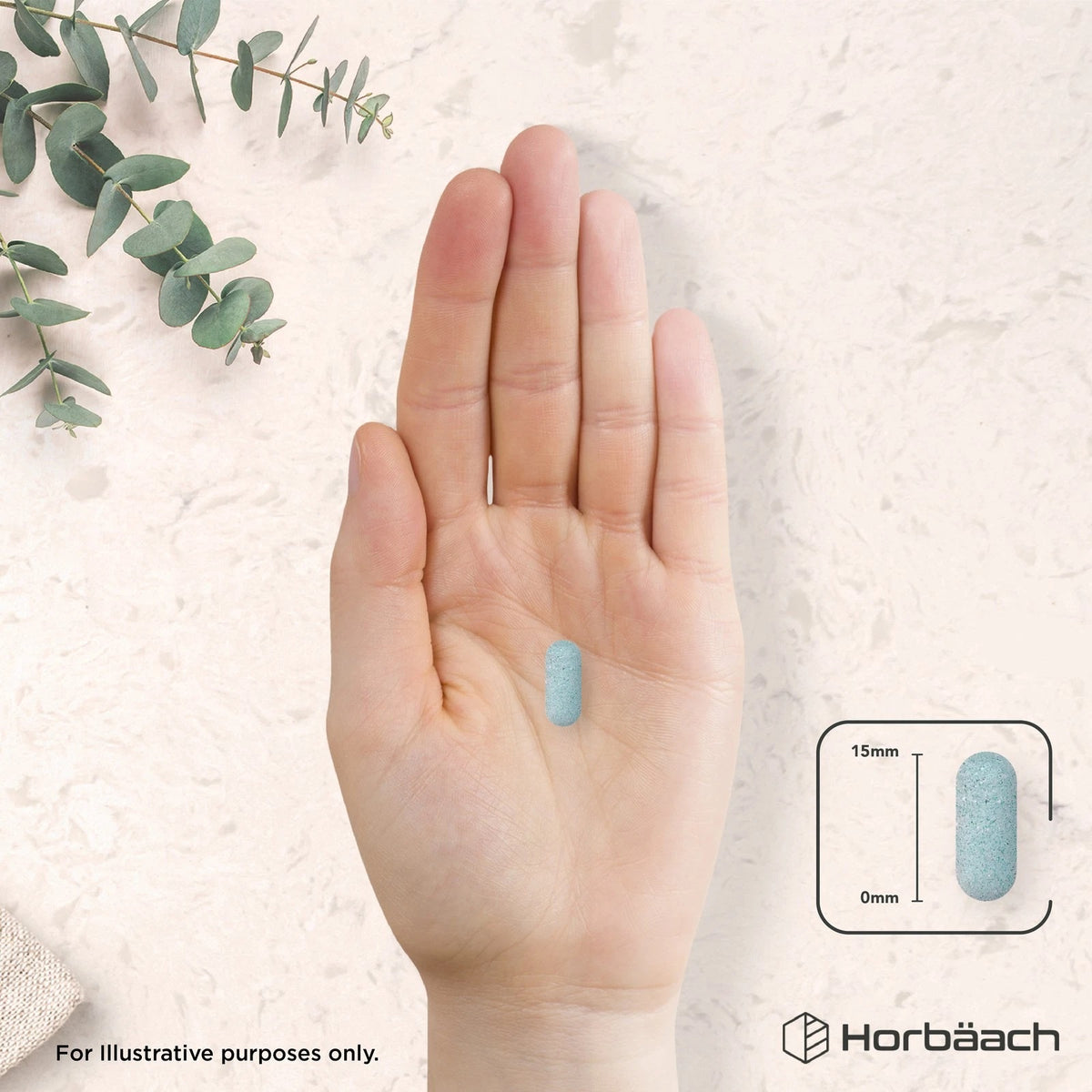 A light blue, oblong tablet held in hand, with a graphic showing it measures 15mm in length.